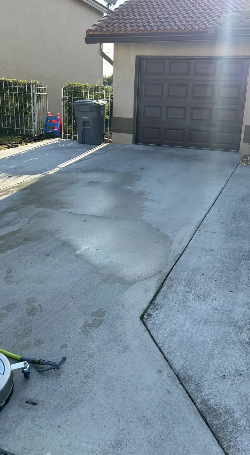 Concrete driveway in front of a garage, before