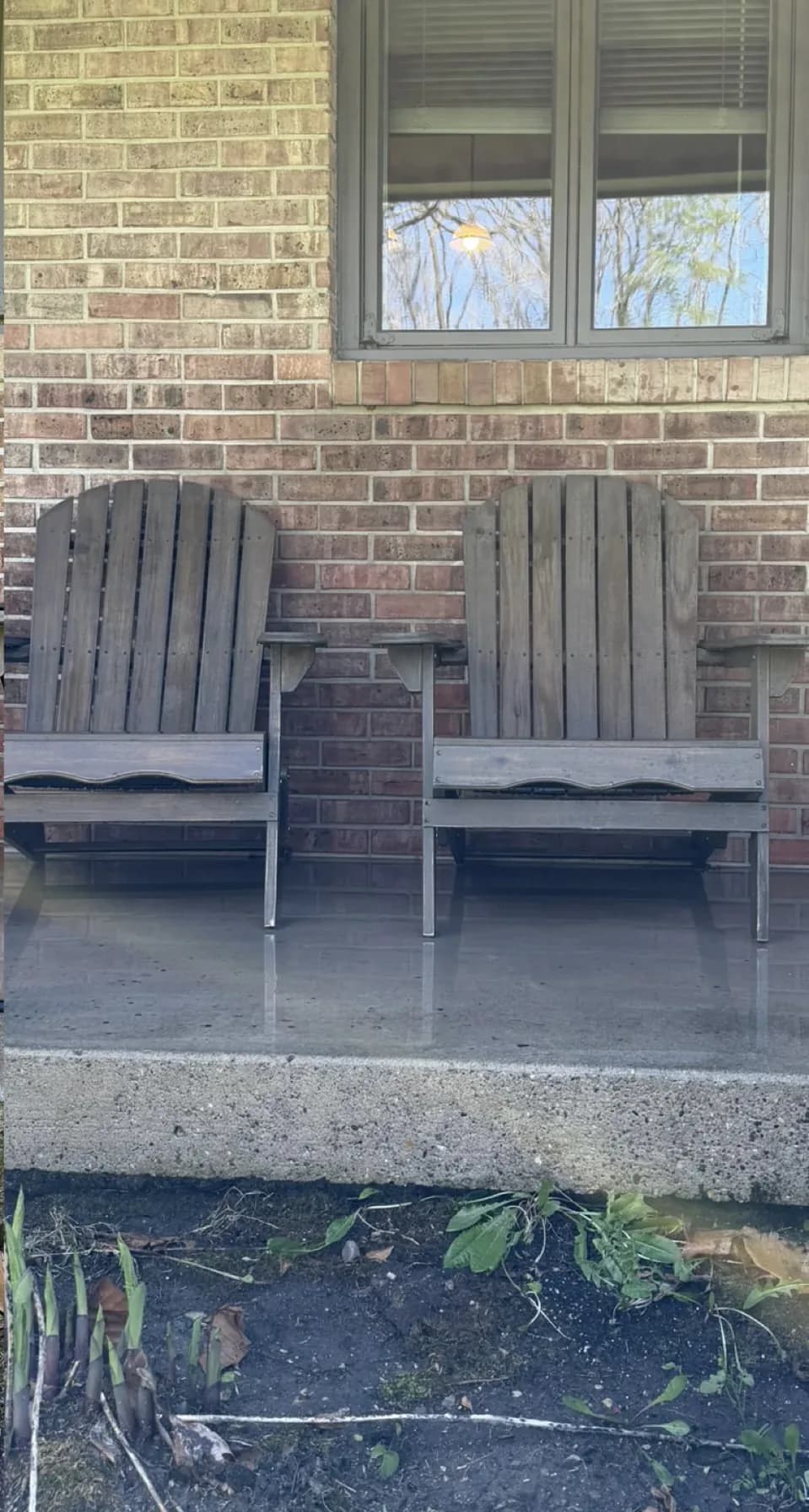 Brick patio with wooden chairs, after