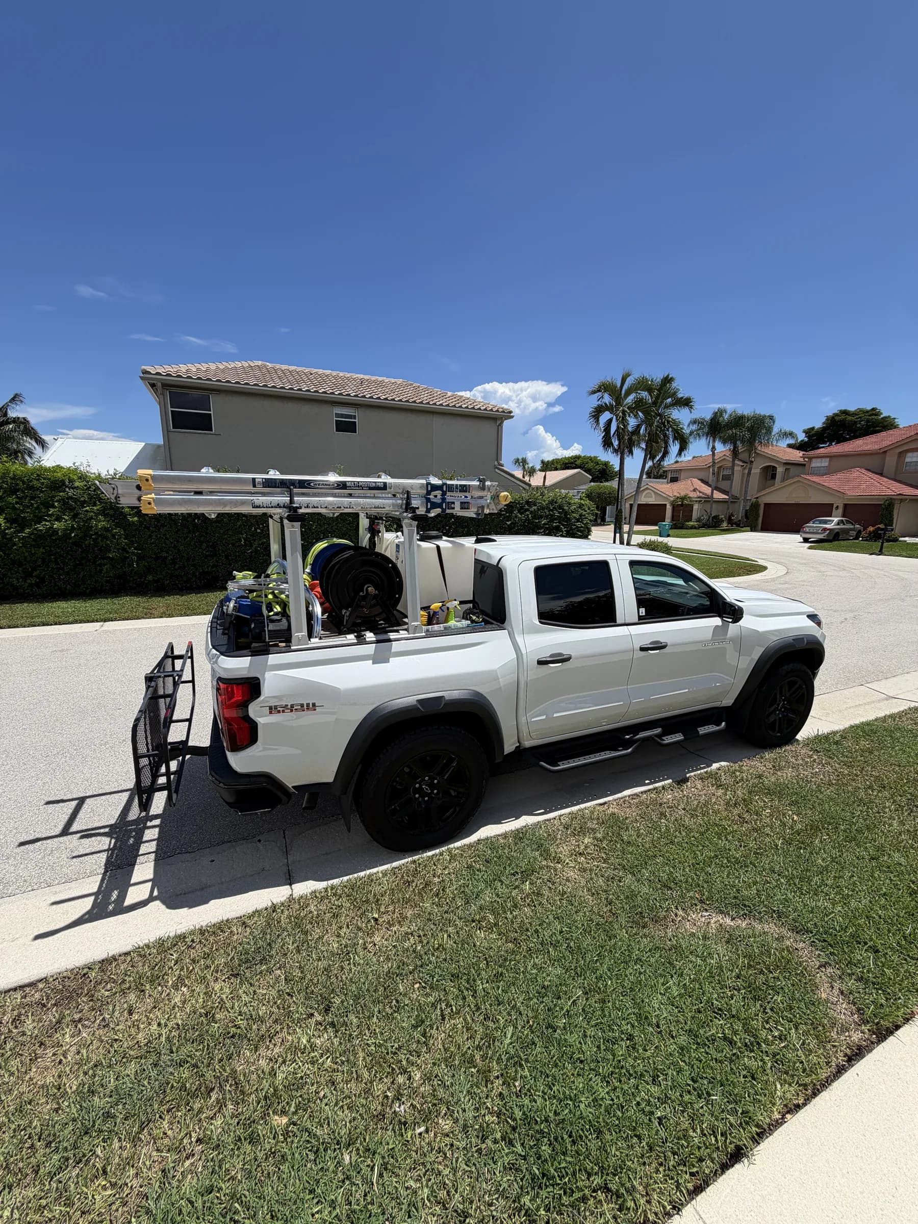 Pure Clean truck parked below a Coral Springs tile roof